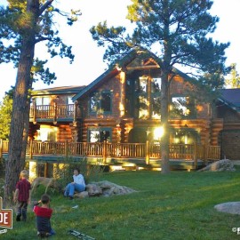 Cascade Handcrafted Log Homes - 3367 Edwards - Rear Corner Deck Actual View